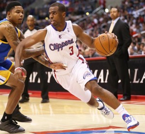 LOS ANGELES, CA - OCTOBER 22:  Chris Paul #3 of the Los Angeles Clippers drives around Kent Bazemore #20 of the Golden State Warriors at Staples Center on October 22, 2012 in Los Angeles, California.  The Clippers won 88-71.   NOTE TO USER: User expressly acknowledges and agrees that, by downloading and or using this photograph, User is consenting to the terms and conditions of the Getty Images License Agreement.  (Photo by Stephen Dunn/Getty Images)